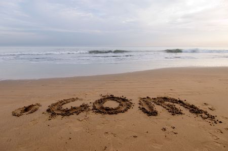 dot com written on the sandの写真素材