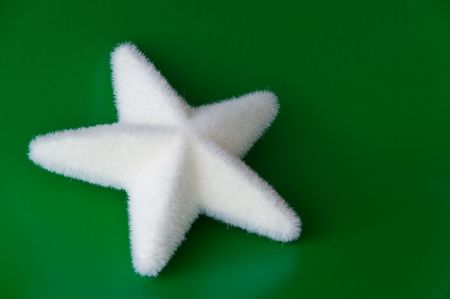 white christmas star against a green backgroundの写真素材