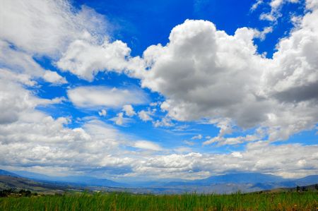beautiful green meadow and a nice cloudscapeの写真素材