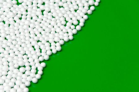 christmas background with snow balls over green