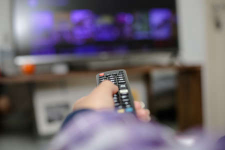 TV remote control in the living room turning on watch movies and series.