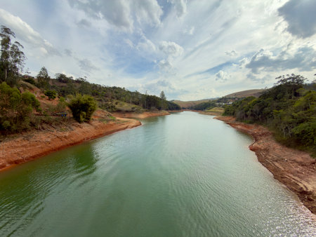 River in the rural area of Brazil with blue sky and white clouds