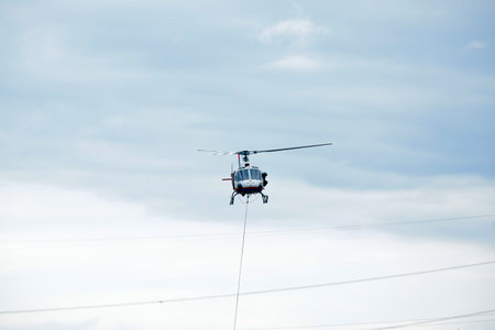Helicopter flying in the sky on a sunny day.の写真素材