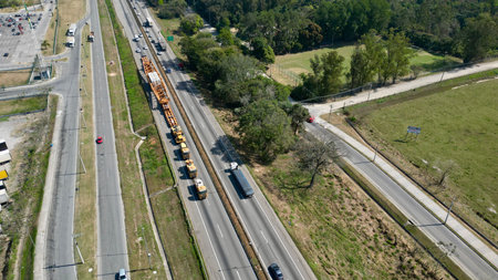 Aerial view of a highway with trucks. Freight transportation.のeditorial素材