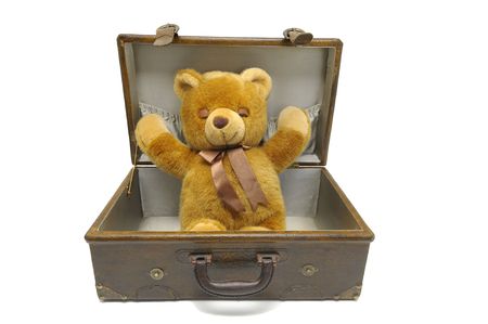Old case with teddy bear isolated against a white backgroundの写真素材