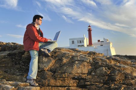 Young man outdoor with laptop
