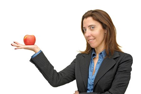 Businesswoman with apple isolated against a white backgroundの写真素材