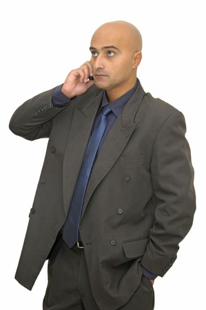 Businessman with cellphone isolated against a white backgroundの写真素材