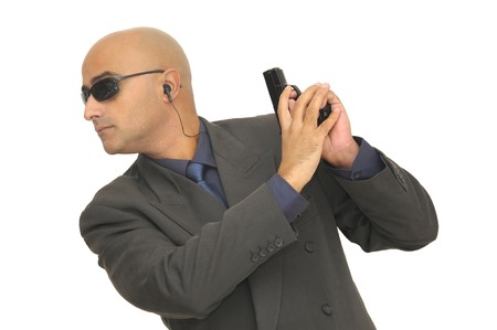 Man with gun isolated against a white background