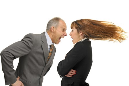Businessman screaming with employeeの写真素材