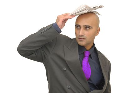 Businessman with newspaper isolated against a white backgroundの写真素材
