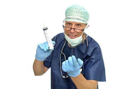Doctor in uniform with huge syringe isolated in whiteの写真素材