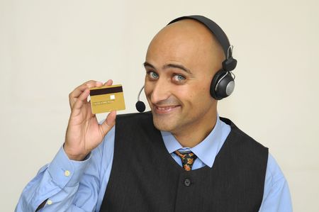 Businessman with headset isolated in whiteの写真素材