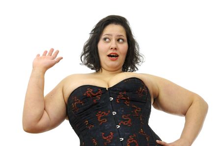 Beautiful large young woman with corset isolated in whiteの写真素材