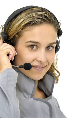 Sexy young girl with an headset  isolated in whiteの写真素材