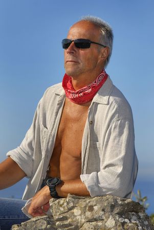 Handsome mature man posing outdoorsの写真素材