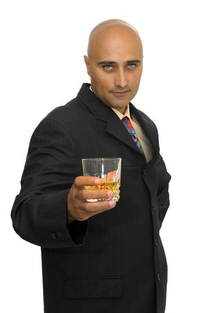 Businessman with a glass of whiskey  isolated in whiteの写真素材