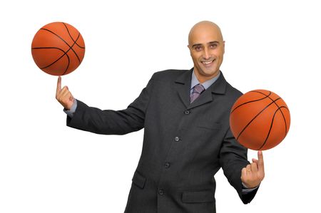 Businessman with several basketballs isolated in whiteの写真素材