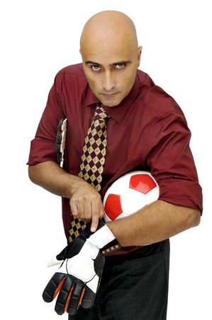Businessman goalkeeper putting his gloves  isolated in whiteの写真素材