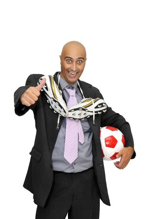 Businessman with a soccer ball  isolated in whiteの写真素材