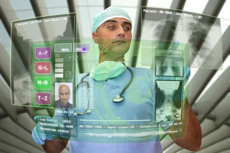 Doctor with hightech computer screen viewing patient dataの写真素材