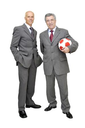 Businessmen with a soccer ball isolated in whiteの写真素材