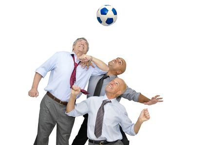 Group of businessmen playing soccer isolated in whiteの写真素材