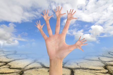 Tree made of hands  over a dry areaの写真素材