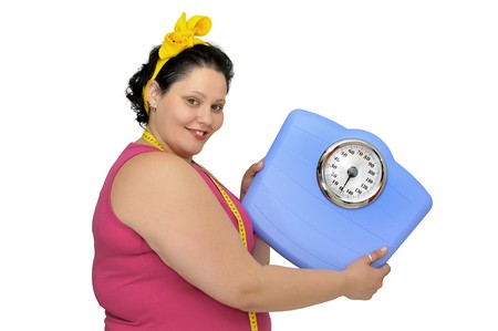 Large girl with scale and measuring tapeの写真素材