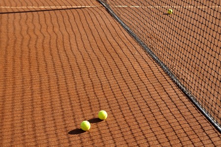Detail of a clay court with tennis ballsの写真素材