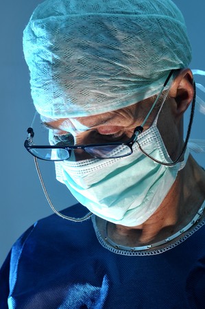 Doctor portrait in surgery in blue tonesの写真素材
