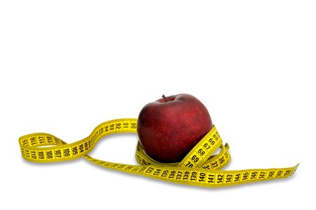 Apple with measuring tape isolated in whiteの写真素材