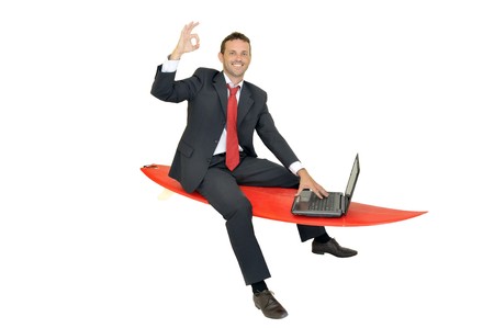 Young businessman with surf boardの写真素材