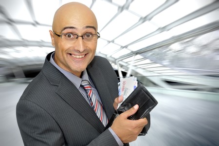 Happy businessman with moneyの写真素材