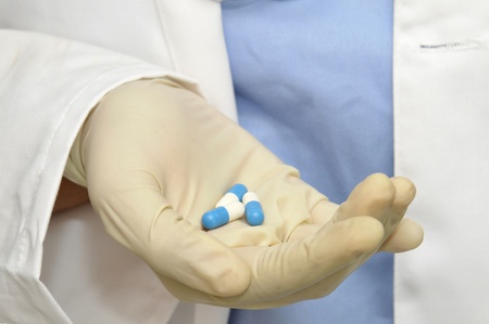 Doctors hand holding  pills or capsulesの写真素材