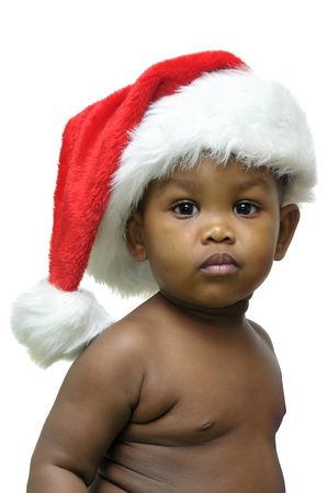 Beautiful baby with Christmas hat isolated in whiteの写真素材