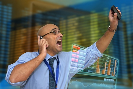 Businessman or stock broker with cellphone
