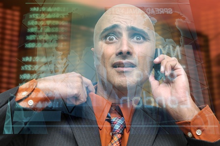 Businessman or stock broker with cellphoneの写真素材