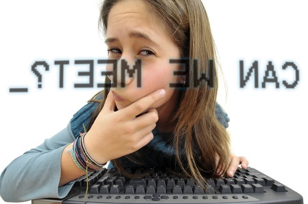 Young girl in the web, with a suspicious invitationの写真素材