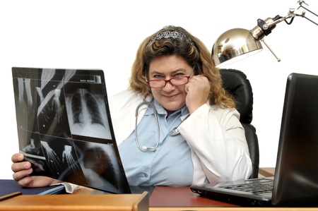 Doctor at the desk with X-ray