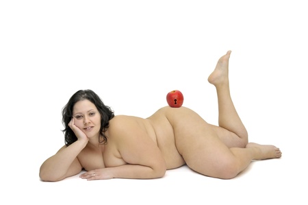 Beautiful nude large girl isolated in white with appleの写真素材