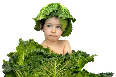 Beautiful young boy inside a cabbage の写真素材
