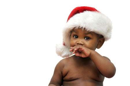 Beautiful baby with Christmas hat isolated in whiteの写真素材