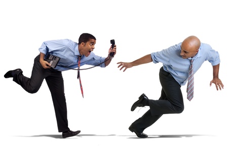Businessmen running with phone isolated in whiteの写真素材