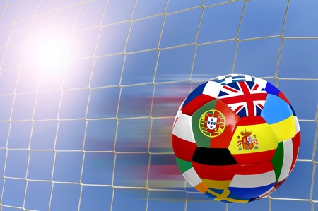 Euro cup soccer ball with flags over a goal's netの写真素材