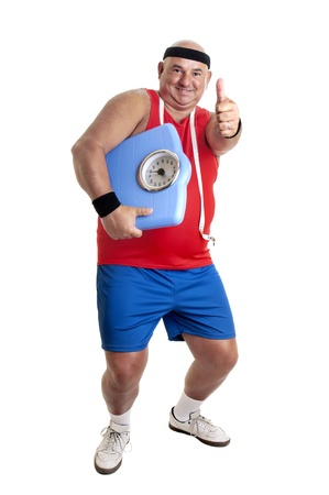 Large fitness man with weight scale isolated in whiteの写真素材