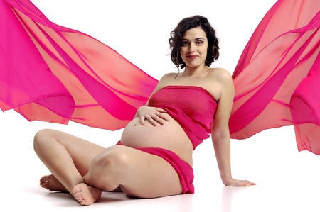 Beautiful pregnant woman with pink scarf