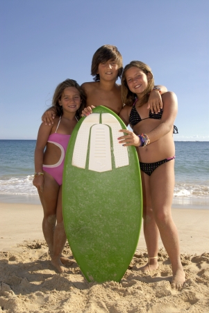Siblings having fun on the beachの写真素材