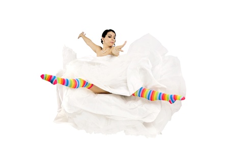 Happy bride jumping with colorful stockings 