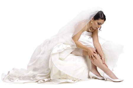 Beautiful bride posing isolated in whiteの写真素材